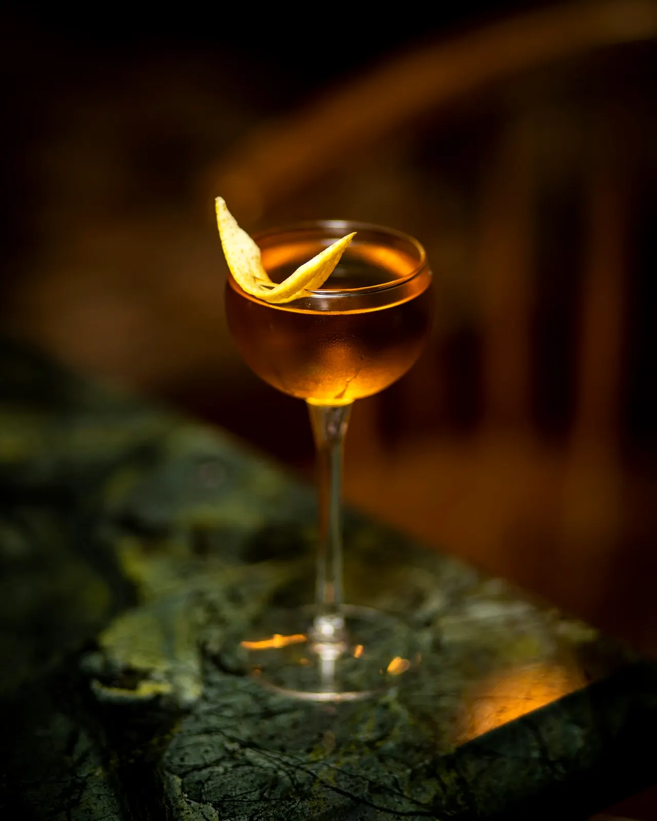 An old fashioned cocktail with an orange twist